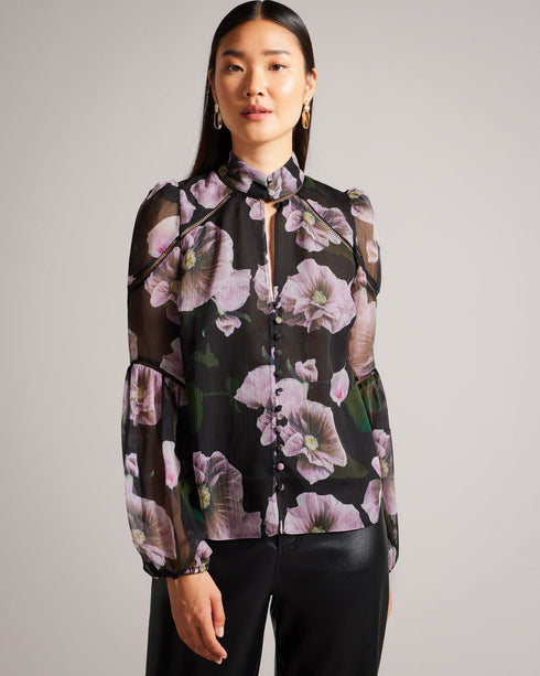 THEERA-Tops-Introducing the stunning THEERA blouse, a masterpiece of texture and print. Its textured fabric and photographic floral print are a feast for the eyes, while the stand collar with a keyhole cut-out add a touch of intrigue. With button fastening and delicate ladder lace inserts, this blouse will capture attention wherever you go. Textured blouse Photographic floral print Stand collar with keyhole cut-out Button fastening Ladder lace inserts Blouson sleeves Lined body- Ted Baker Romania